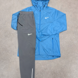 Nike - Blauwe vest + Grijze broek